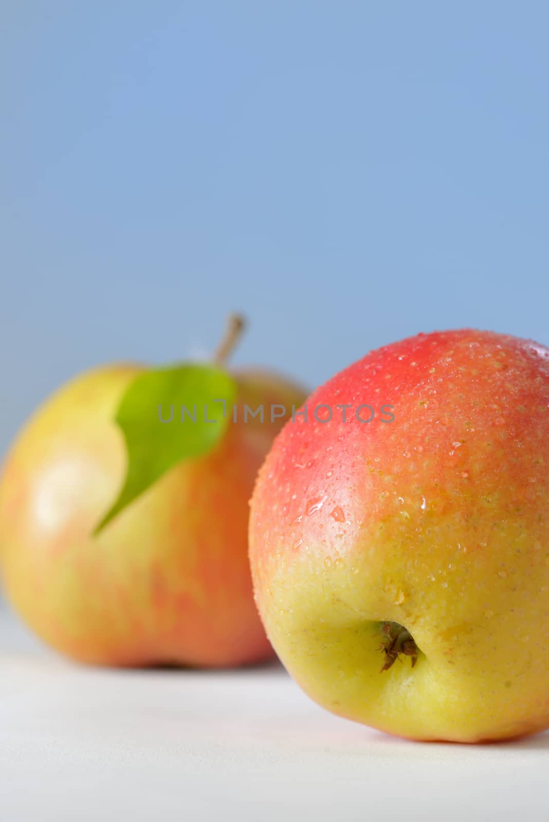 apples with dew drops on table