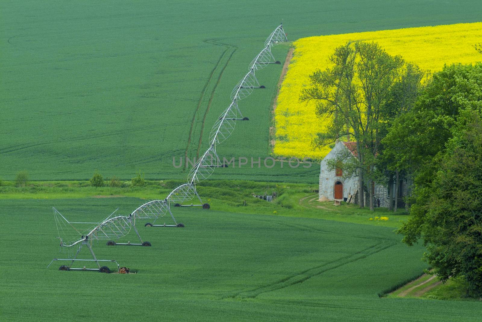 Agricultural irrigation system watering field, France