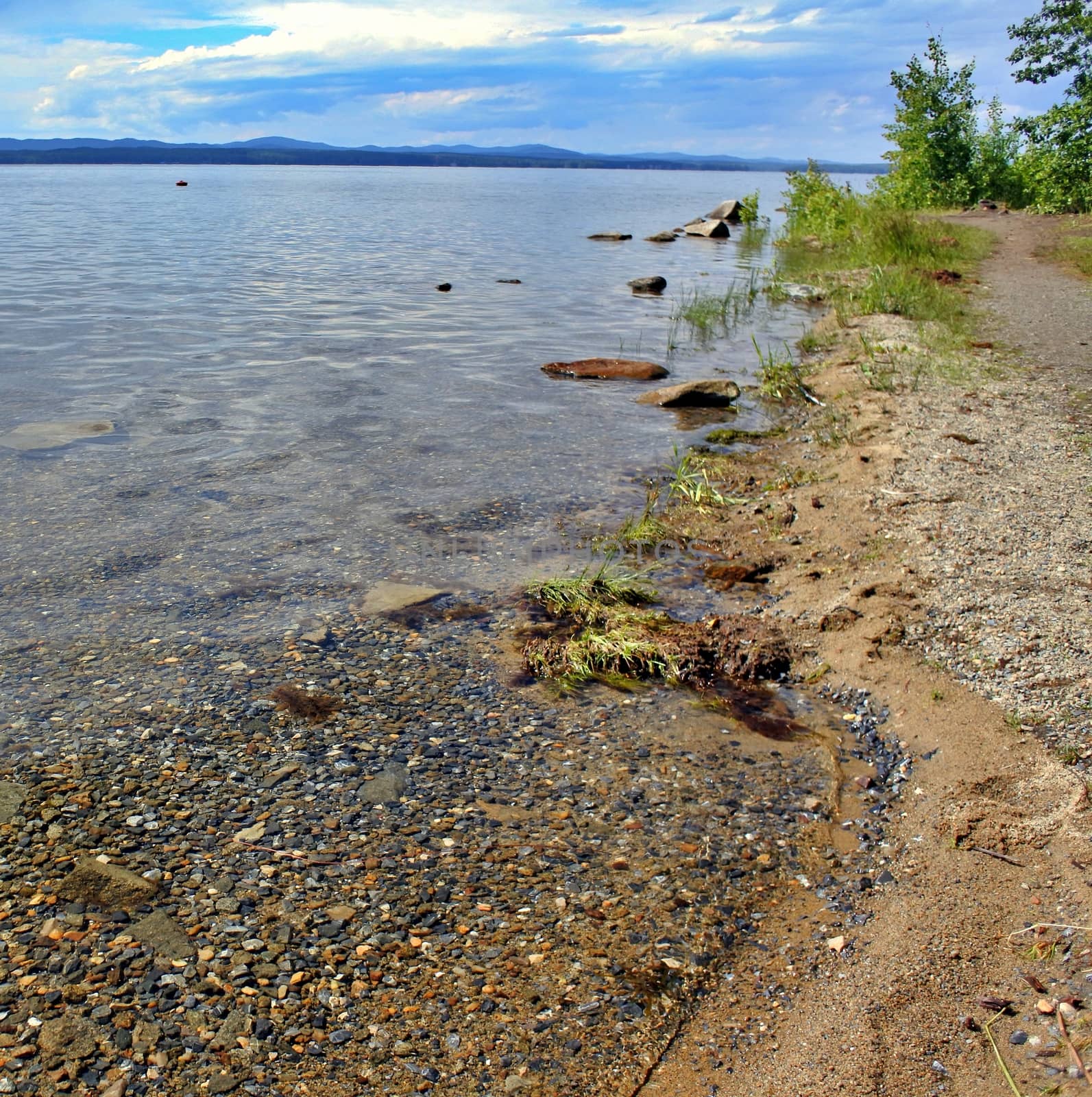 Crystal clear water of Lake Uwildy in Southern Urals in summer