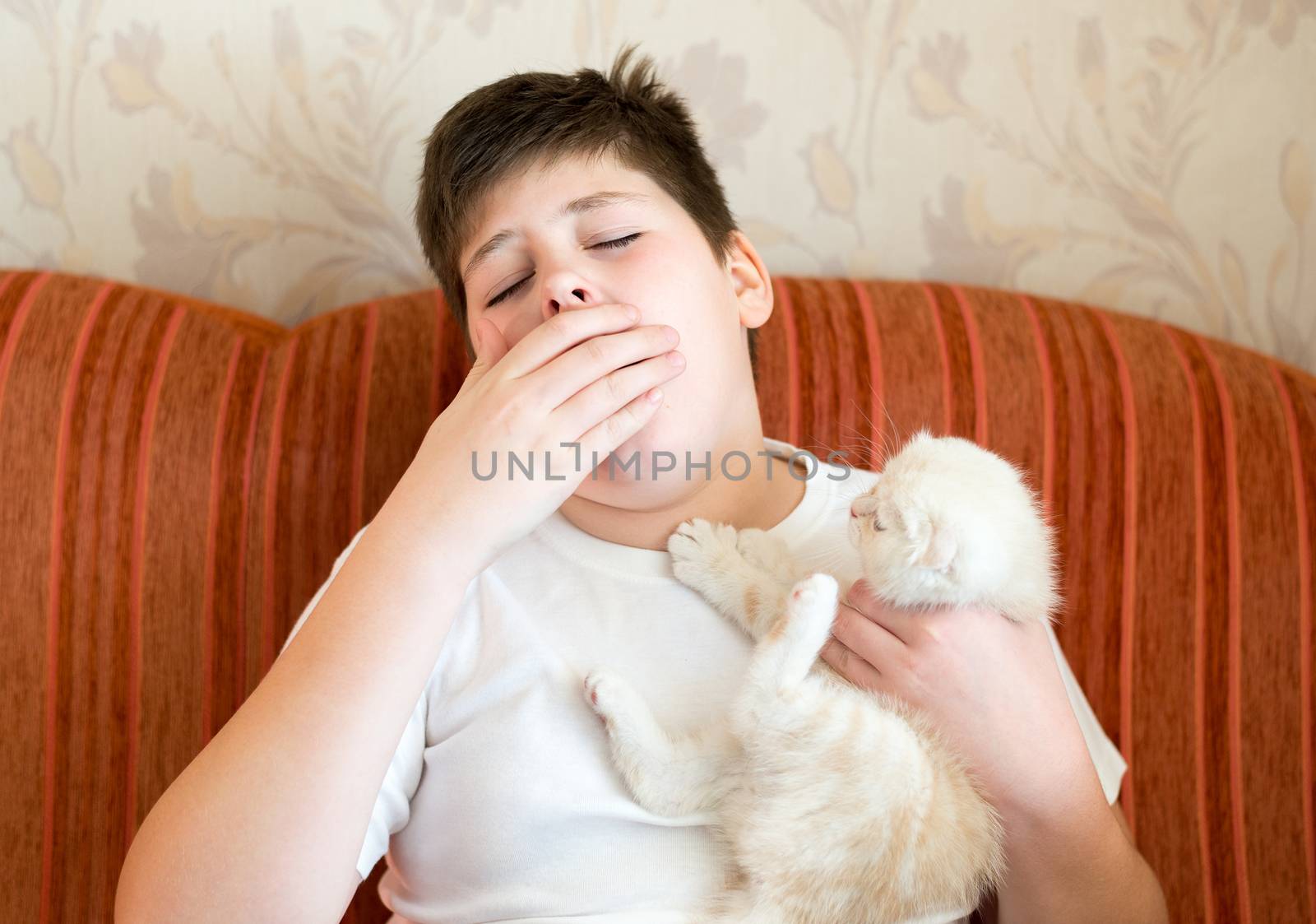 The boy is allergic to a cat