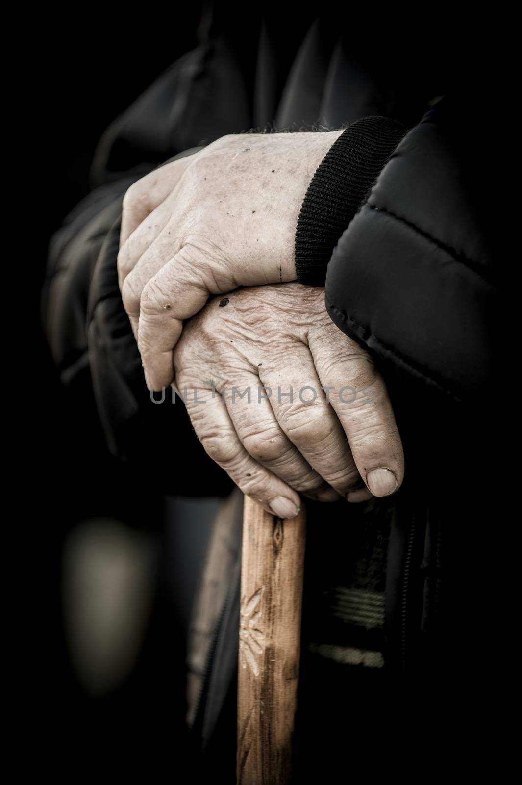 Old people, hands on a cane as main concept, France