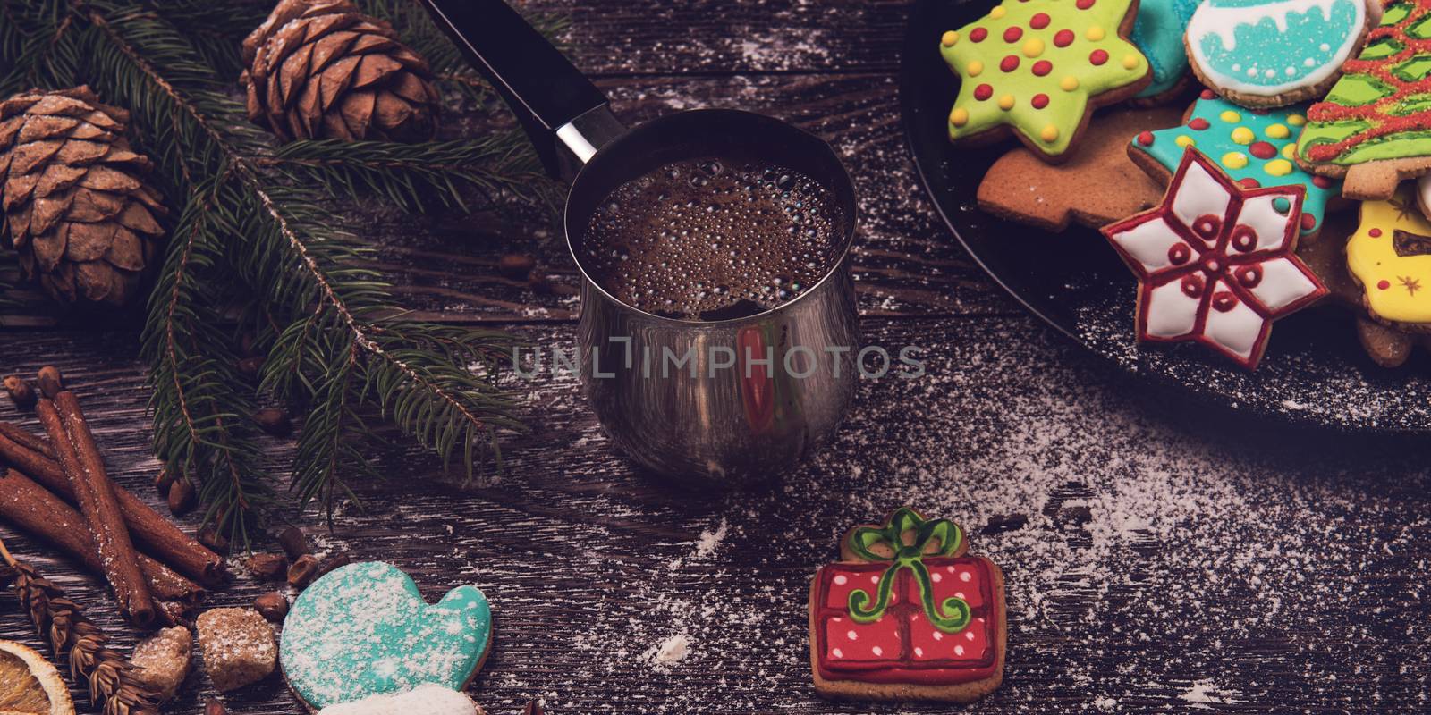 Gingerbreads with coffee for new years and christmas on wooden background, xmas theme