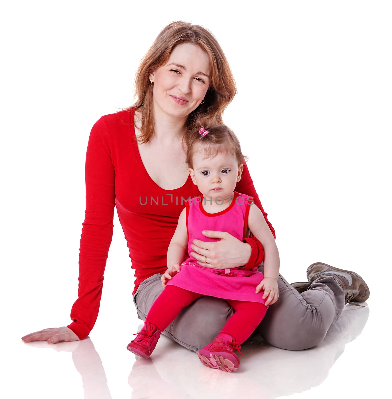 Mother playing with one year daughter isolated on white