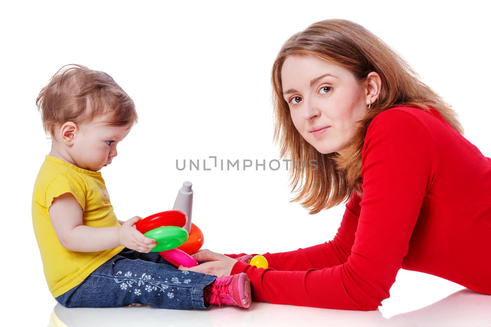 Mother playing with one year daughter isolated on white