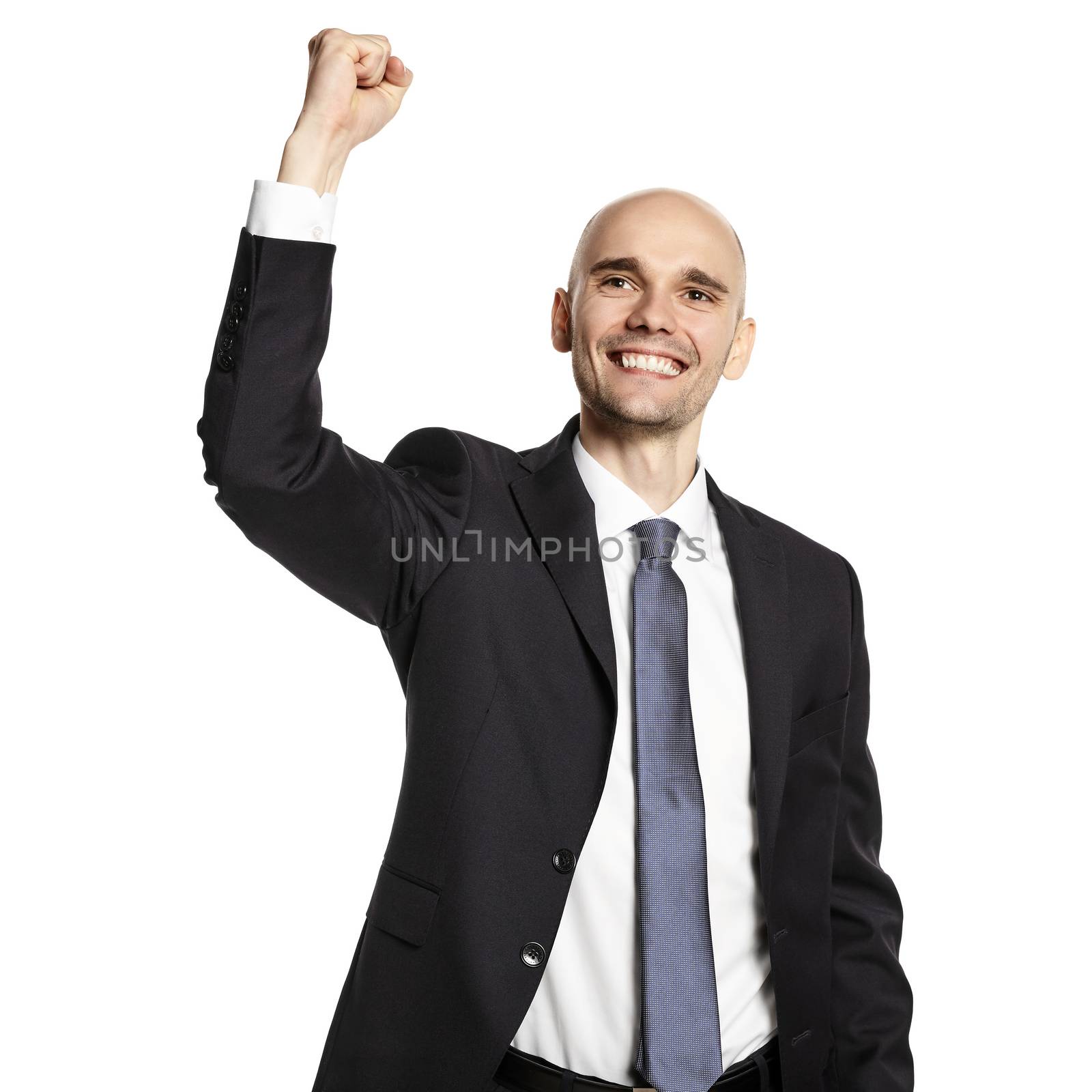 Studio shot of happy young businessman celebrating his success. 