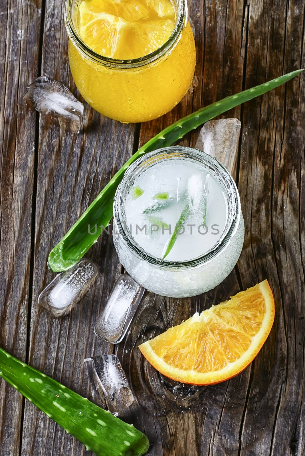 glass of medicinal drink sap from aloe leaf and orange