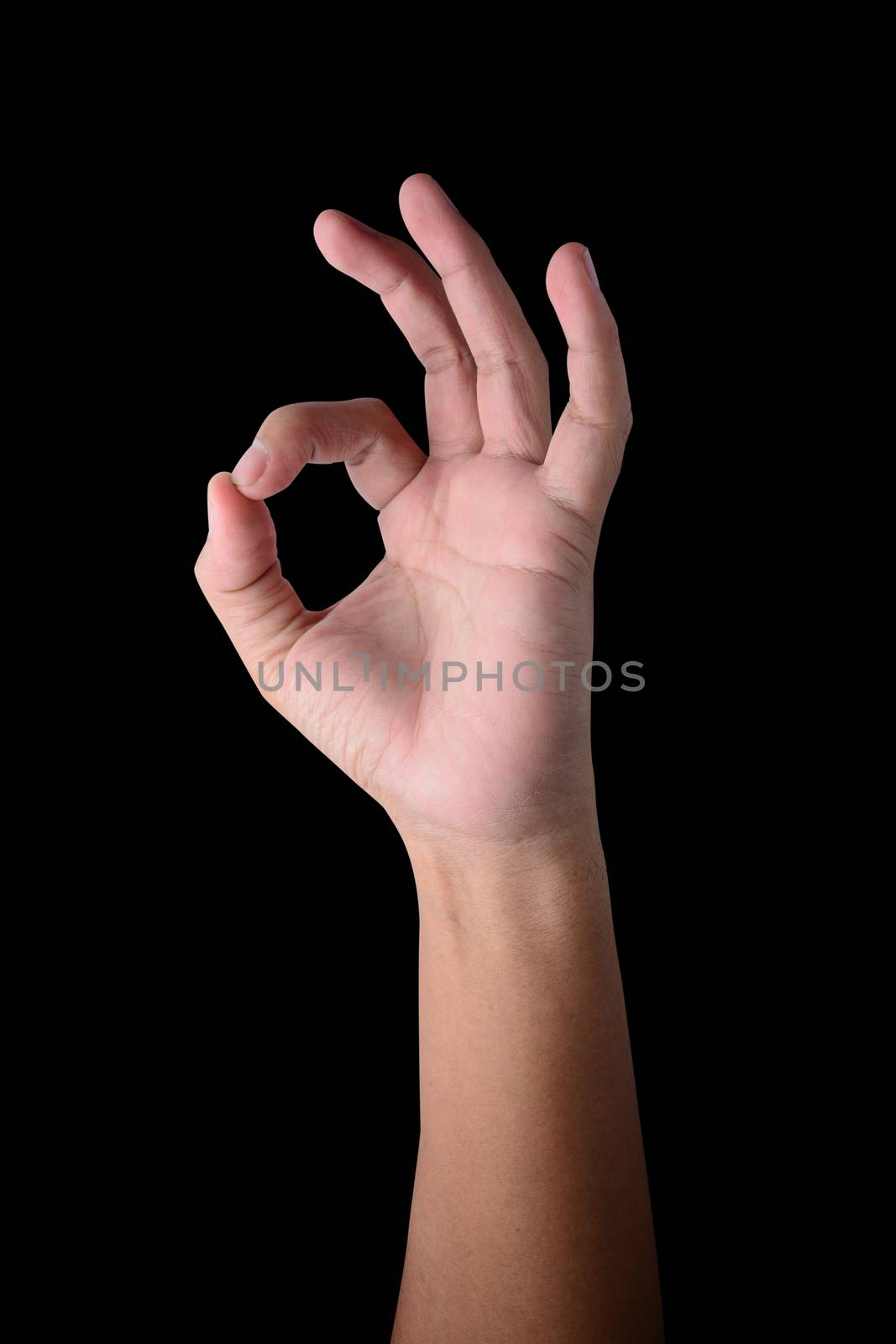 Hand OK sign on isolated on black by ipuwadol