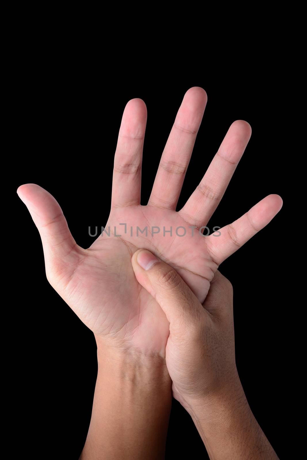 Close up male holding hand isolated on black with clipping path. Hand pain concept.