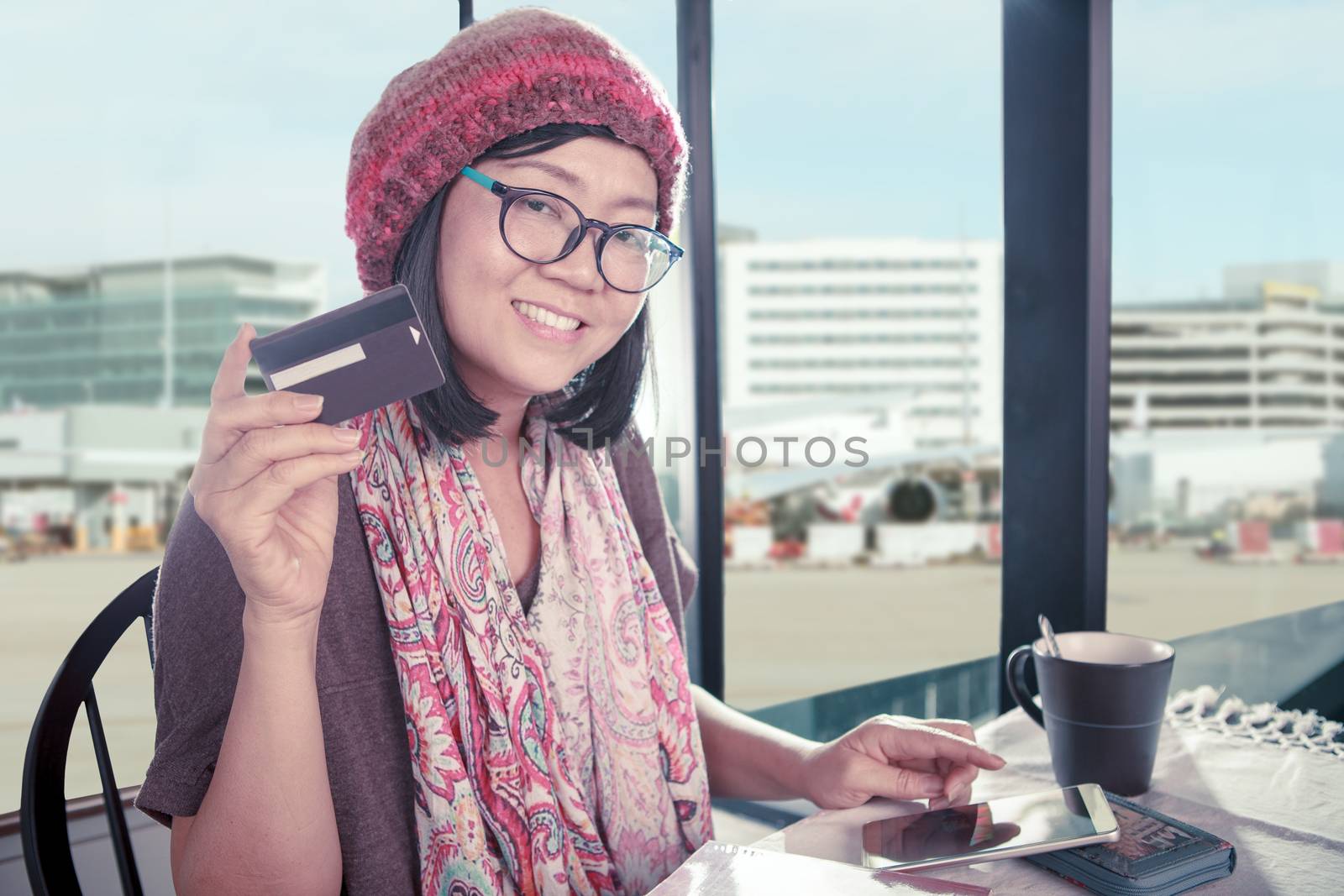 asian woman happiness smiling face with credit card in hand use  by khunaspix
