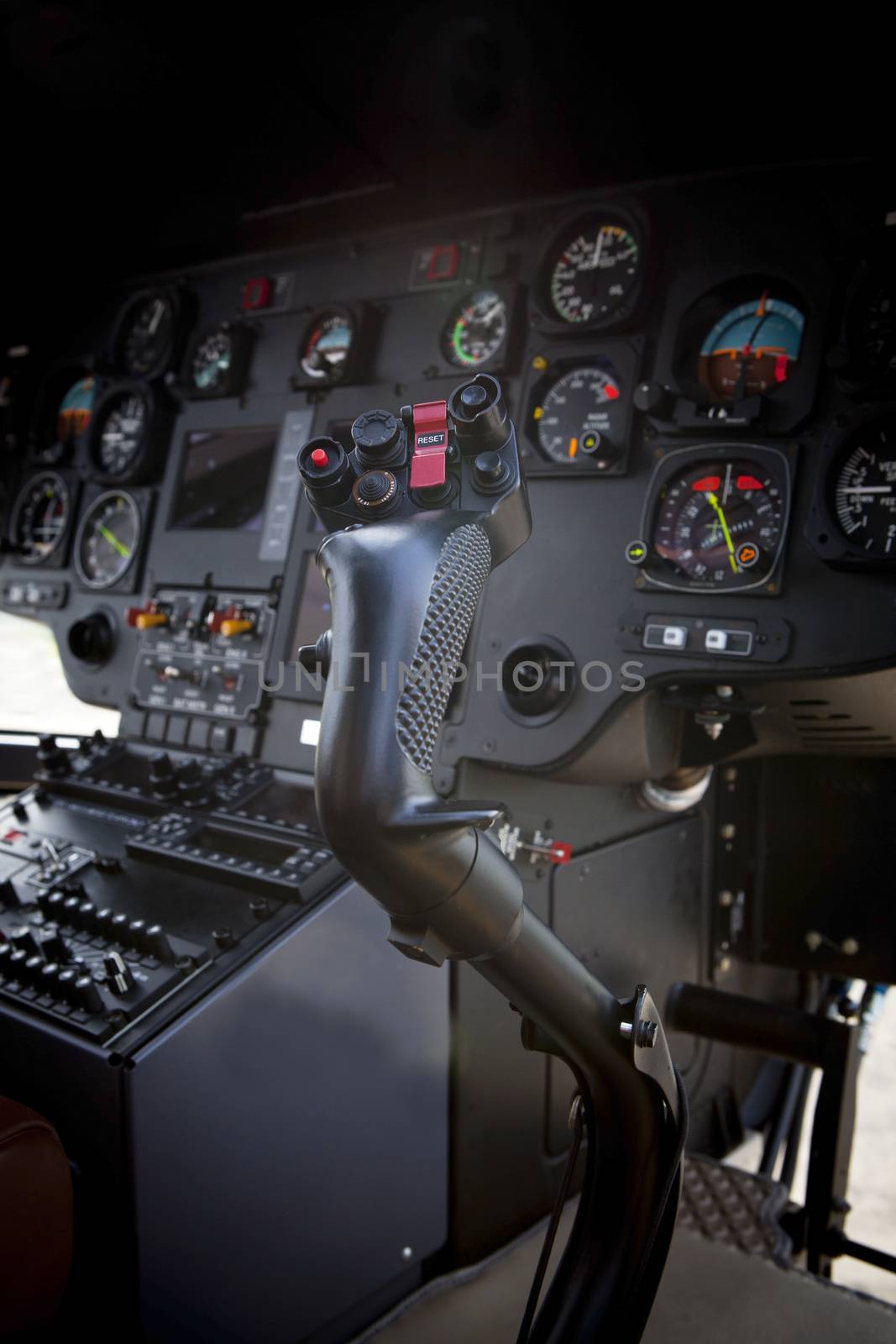 control stick in helicopter cockpit with shallow depth of field