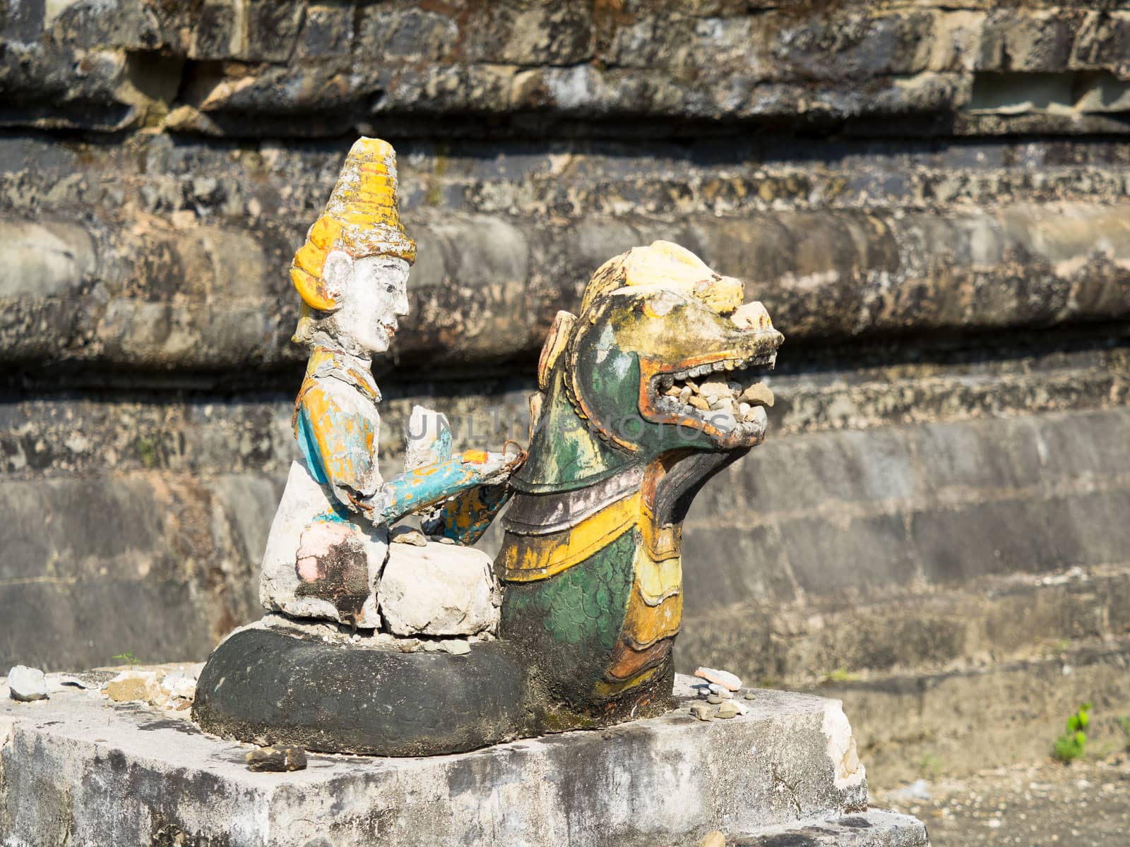 Broken, religious figurine in Mrauk U, Myanmar by epixx