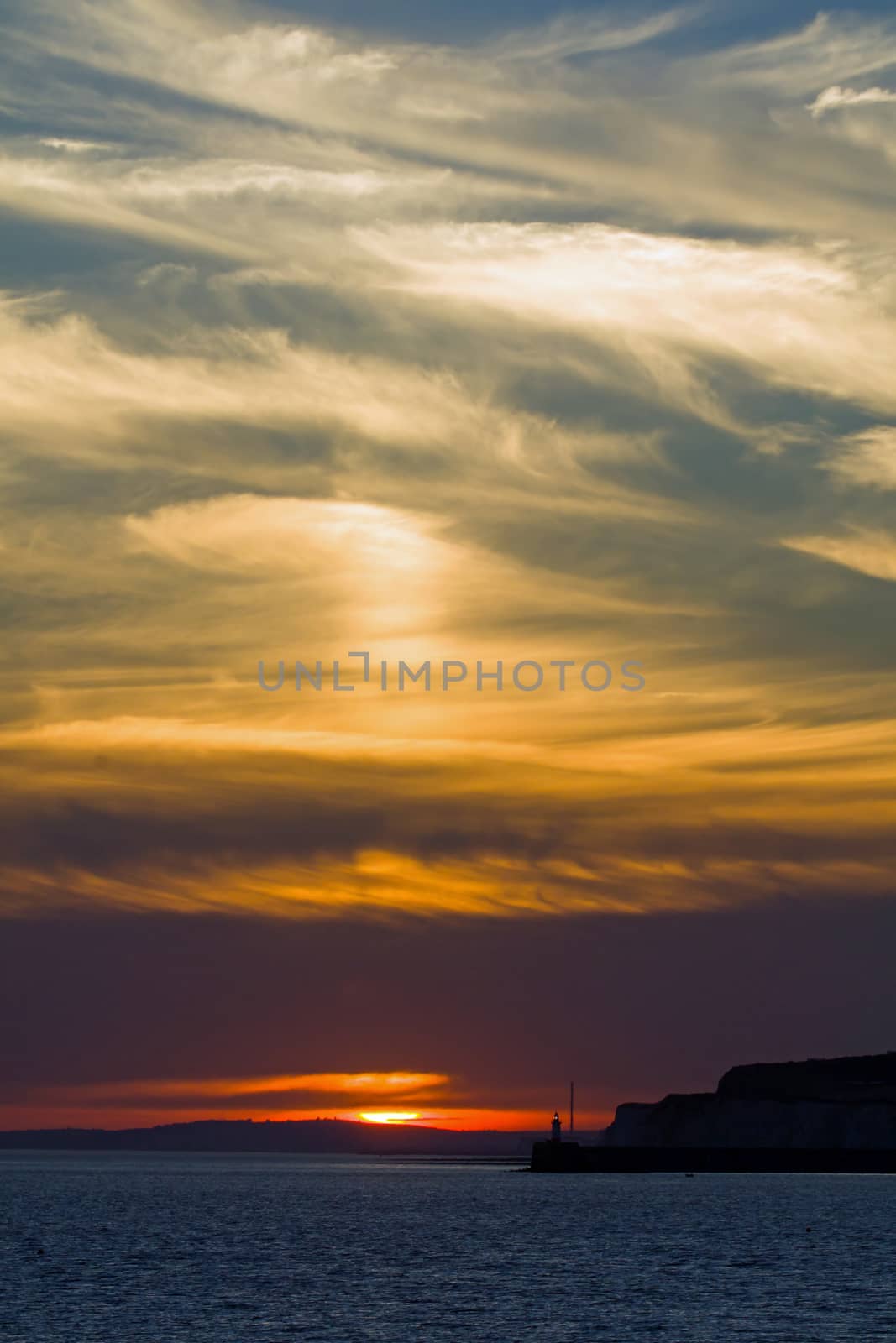 Sunset at Newhaven, with clouds and Newhaven Lighthouse.