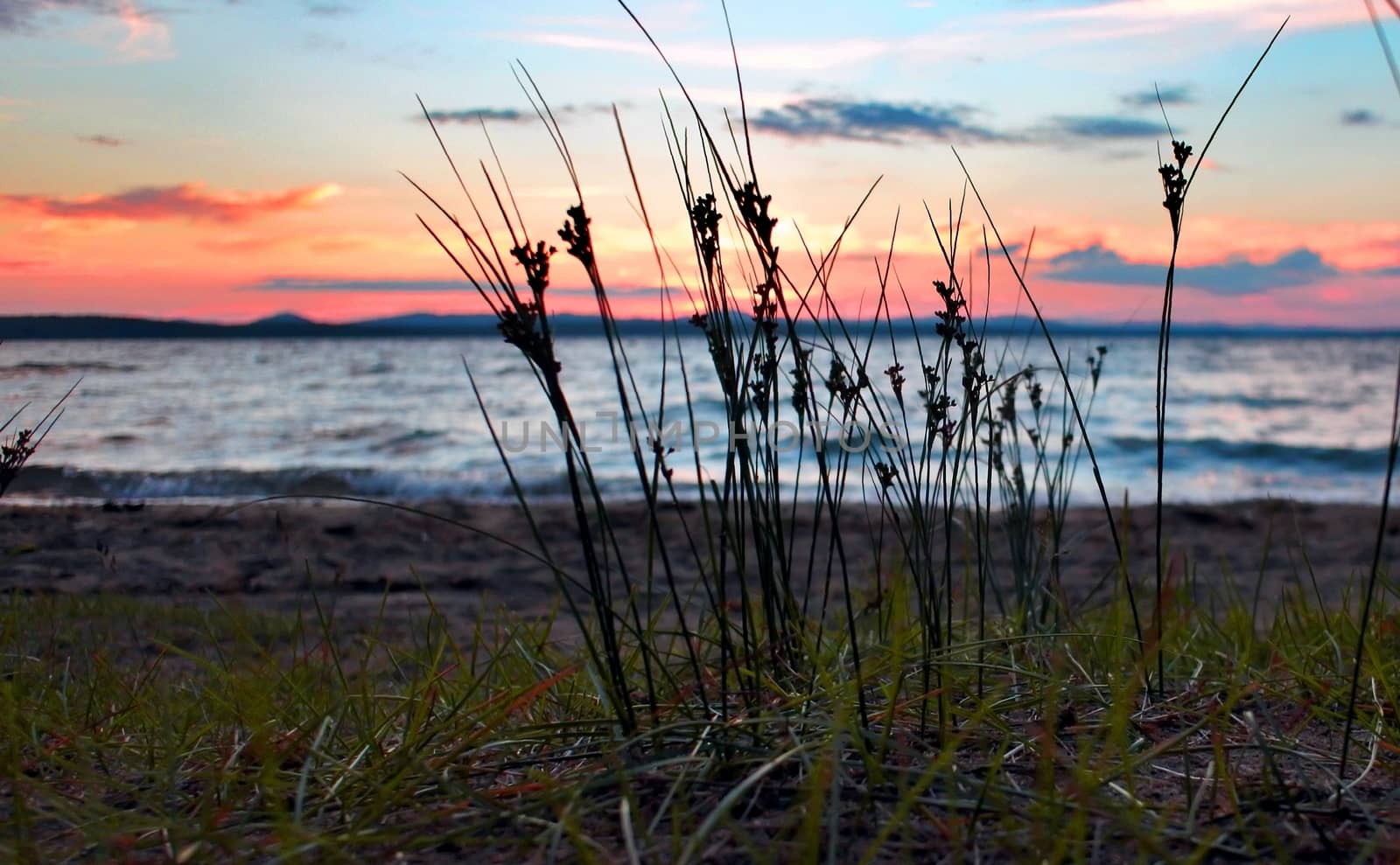 dramatic sunset on the shoreline of the lake