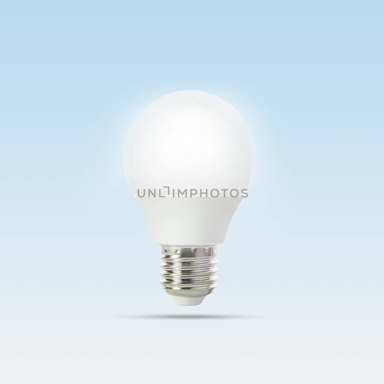 growing of led light bulb floating on gradient  light blue to wh by khunaspix