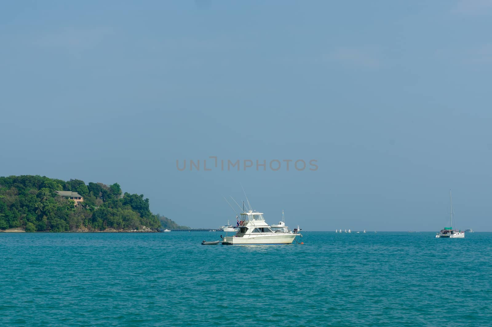 Beautiful landscape seaview with a boat at beach of Laem Panwa Cape famous attractions in Phuket island, Thailand
