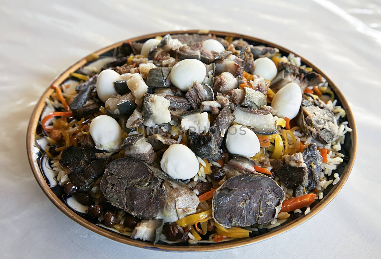 Uzbek national dish pilaf on a plate in a Bukhara restaurant