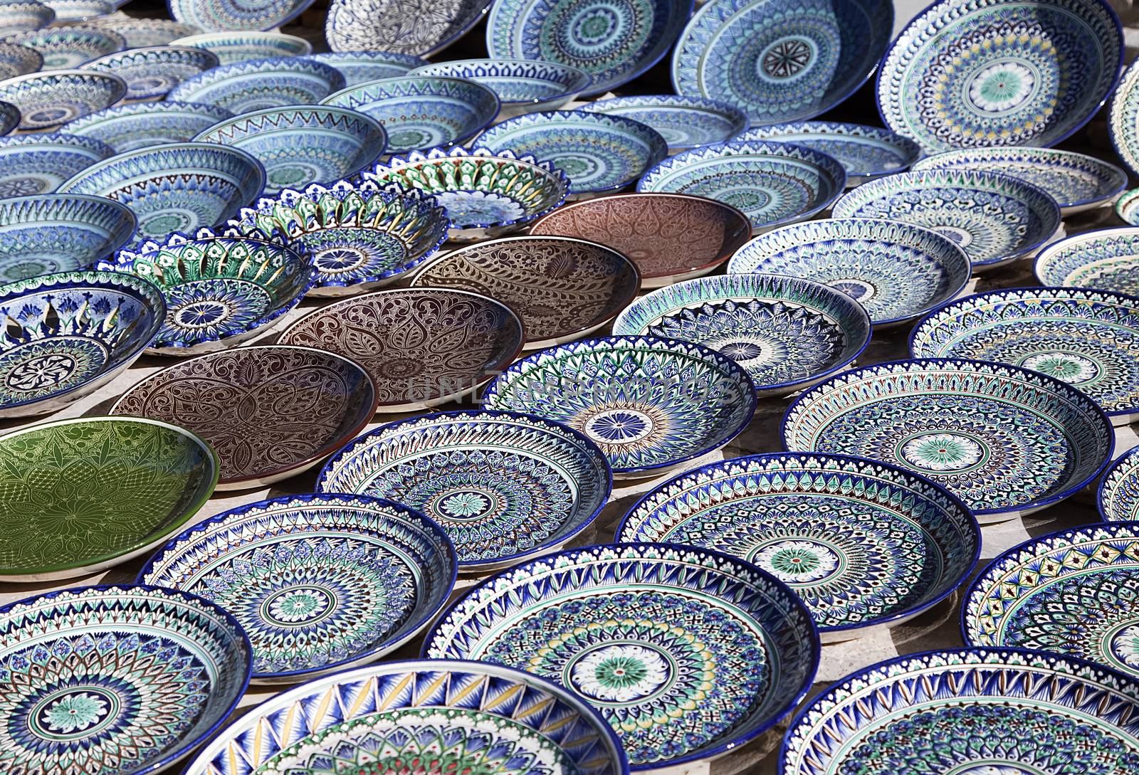 Traditional ceramic dishware in a street market, Uzbekistan