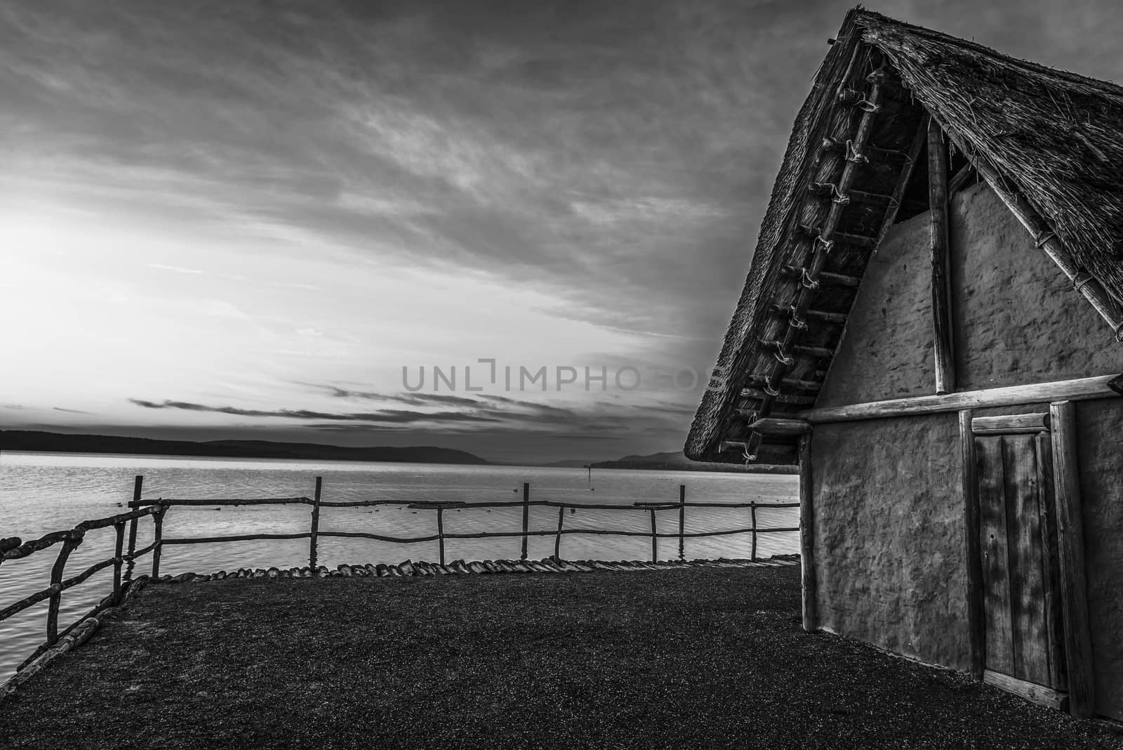 Black and white fishing hut at sunset by YesPhotographers