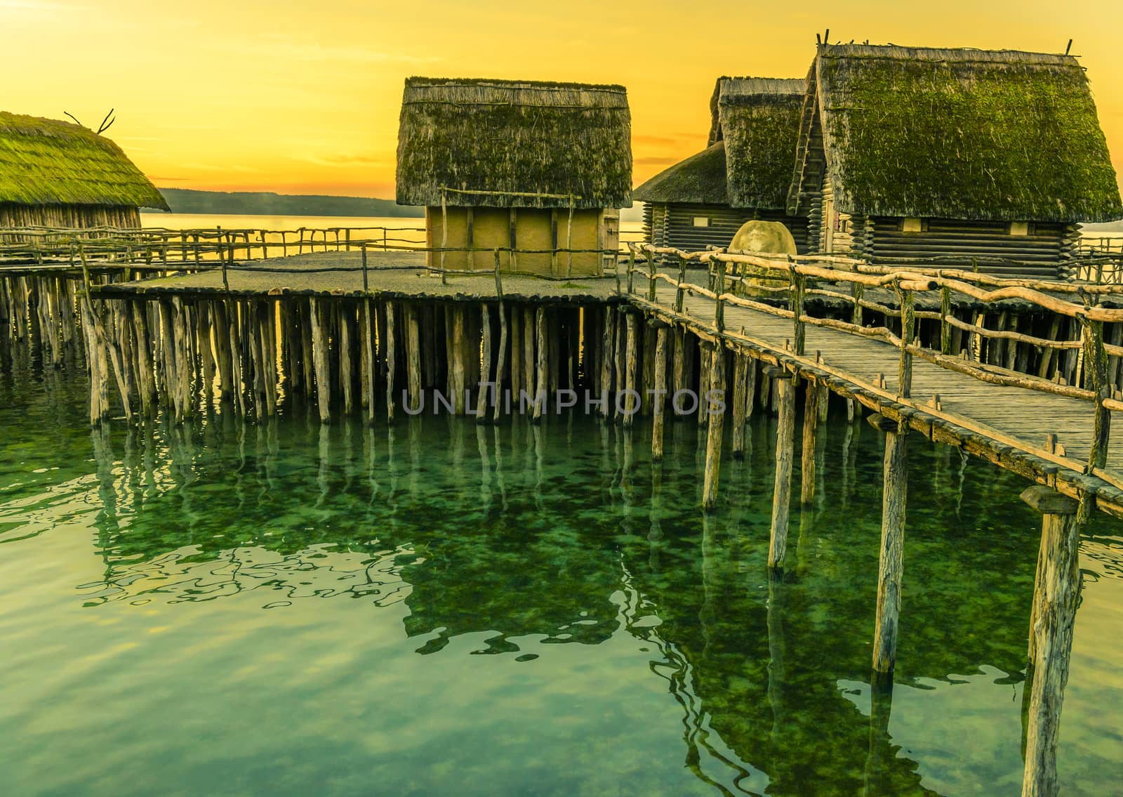 Fishing huts suspended on pillars by YesPhotographers