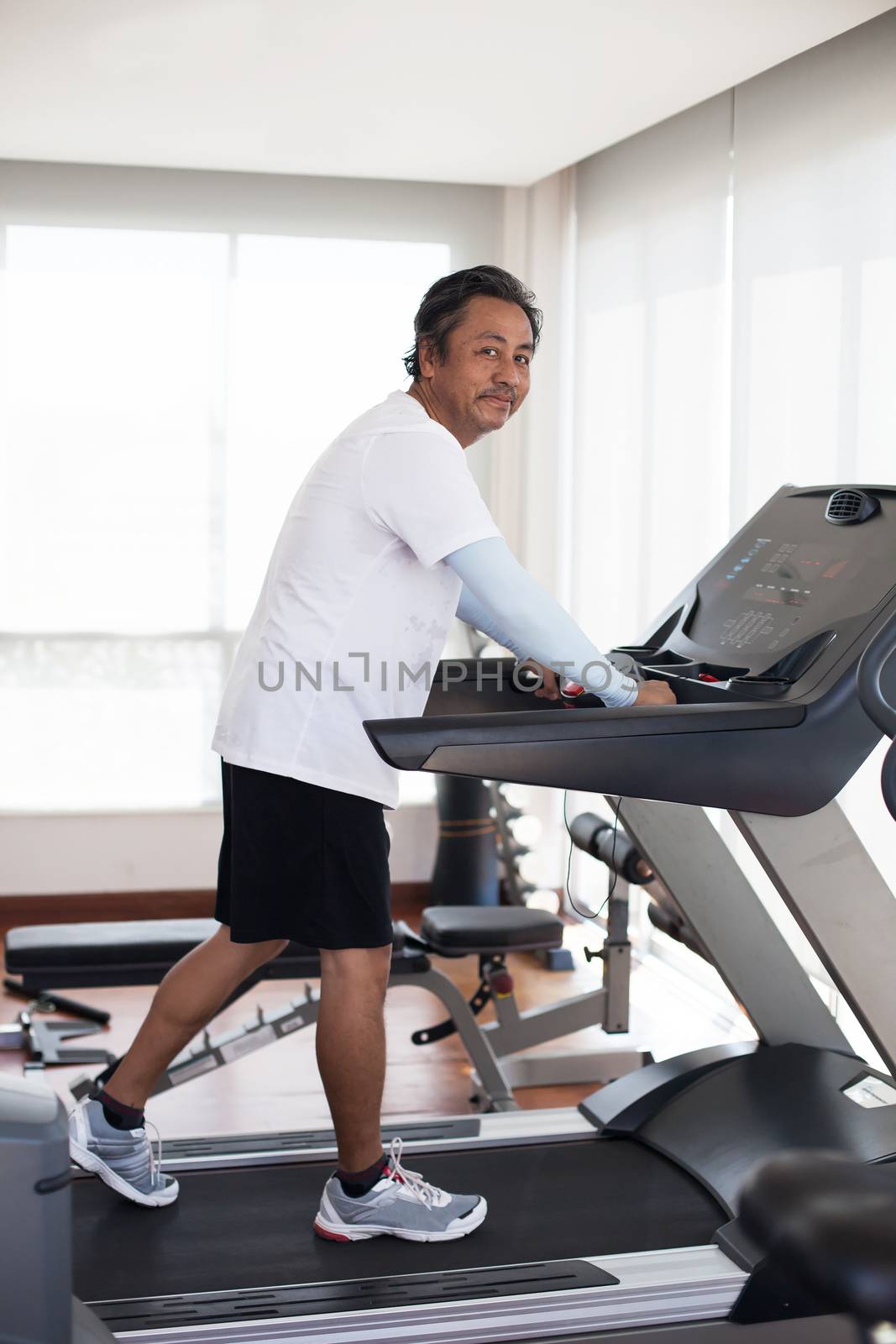 senior man 59s years old in fitness club use for old people and  by khunaspix