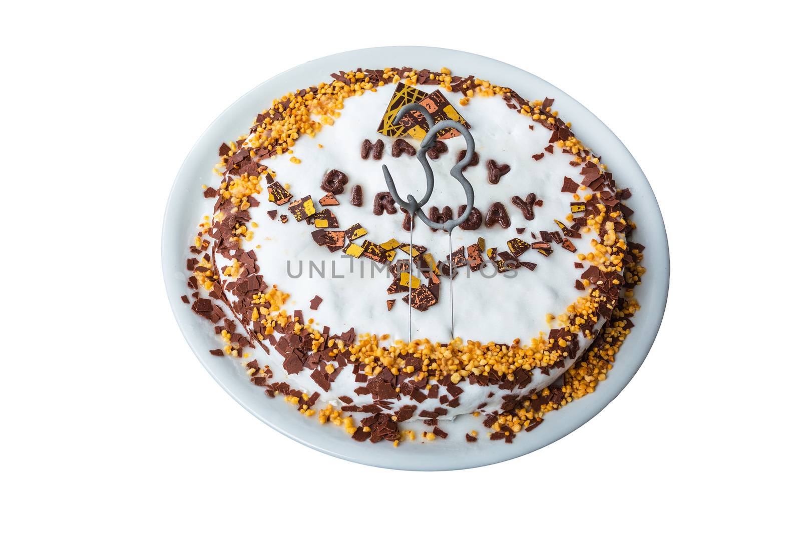 Birthday cake with candles and label in Happy Birthday against white background.