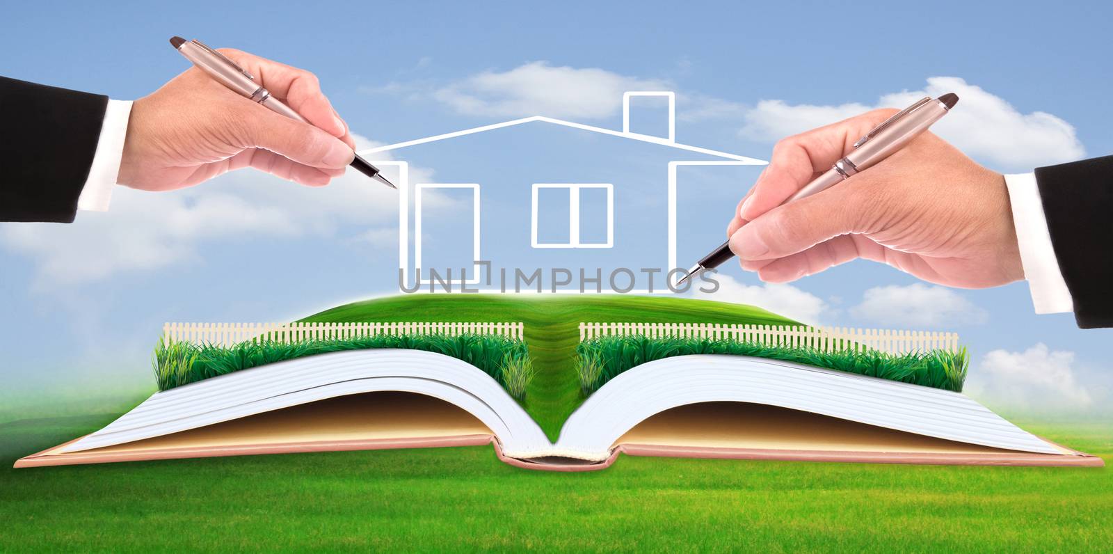 business man writing new house on beautiful green field by khunaspix