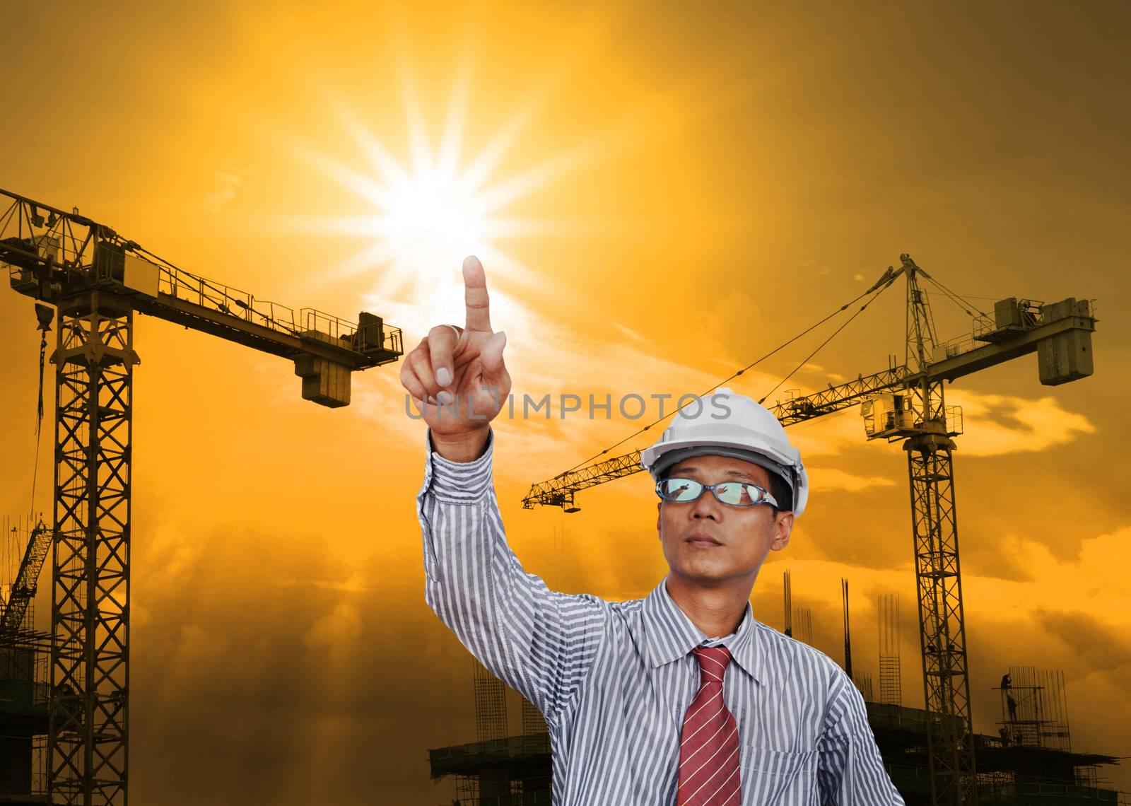 engineering man working in construction site by khunaspix