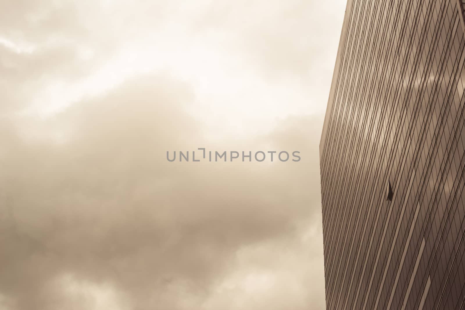 a part of modern business building against blue sky tone sepia