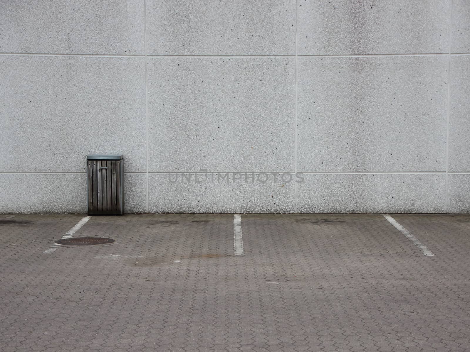 Empty Urban Parking Lot with Trash Can by HoleInTheBox