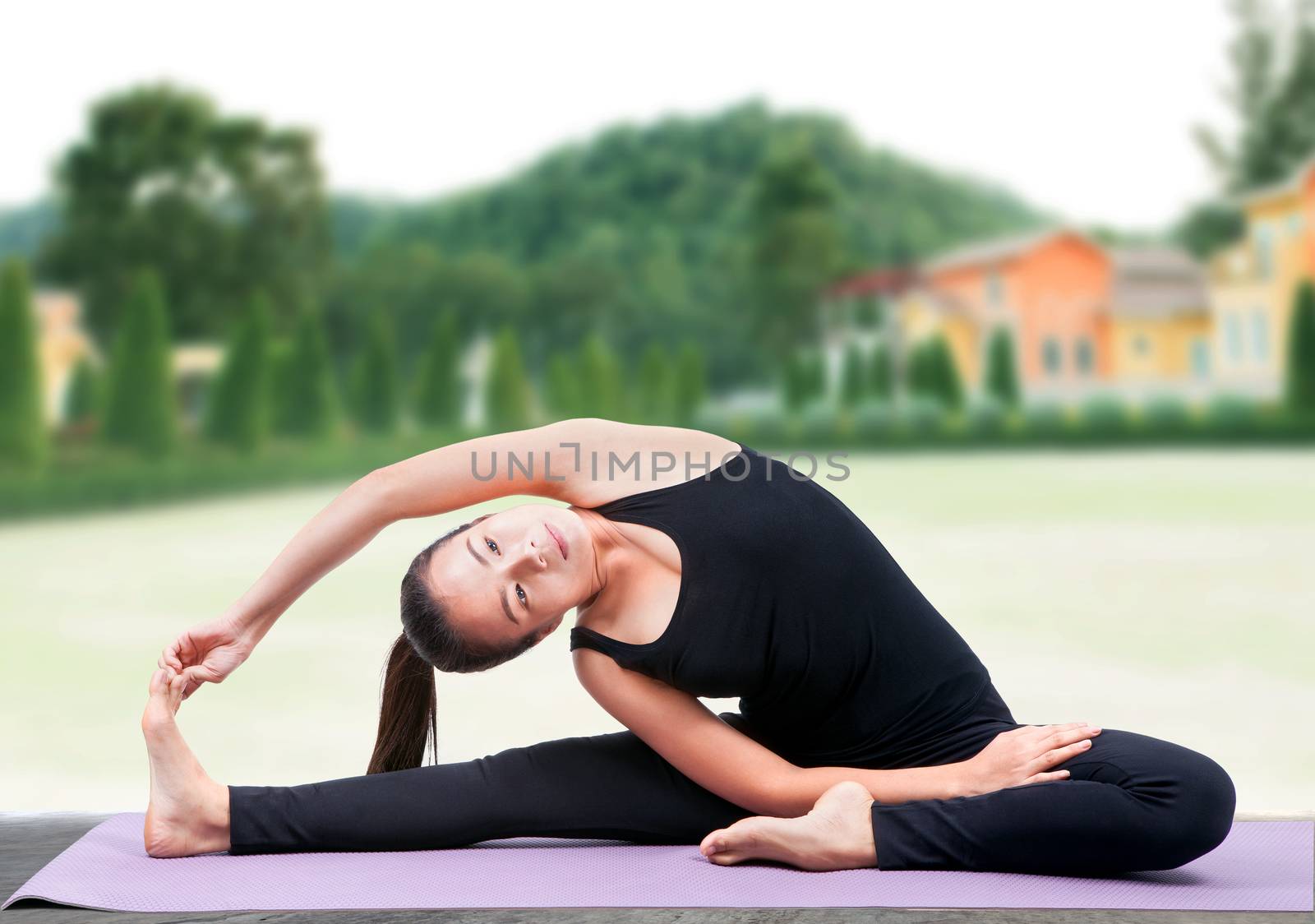 portrait of asian woman wearing black body suit sitting in yoga  by khunaspix