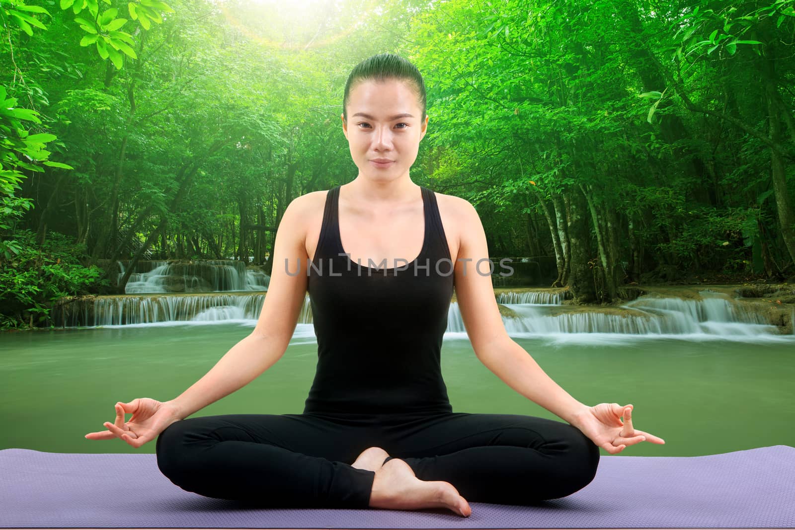 beautiful asian woman doing meditation yoga by khunaspix