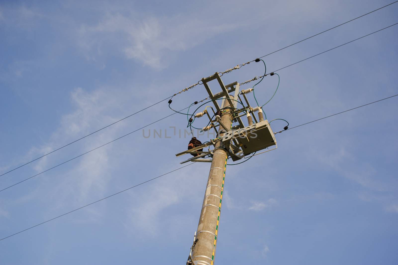 high voltage electrical pole structure on the meadow