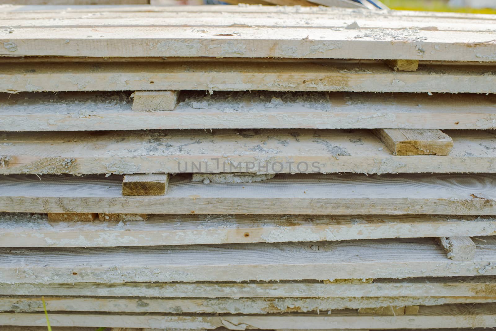 wood stack boards lying on the grass