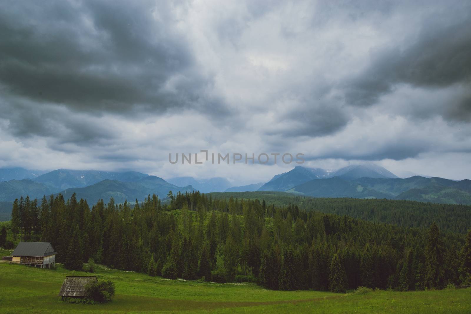Summer mountain landscape with traditional huts in Tatra mountain.