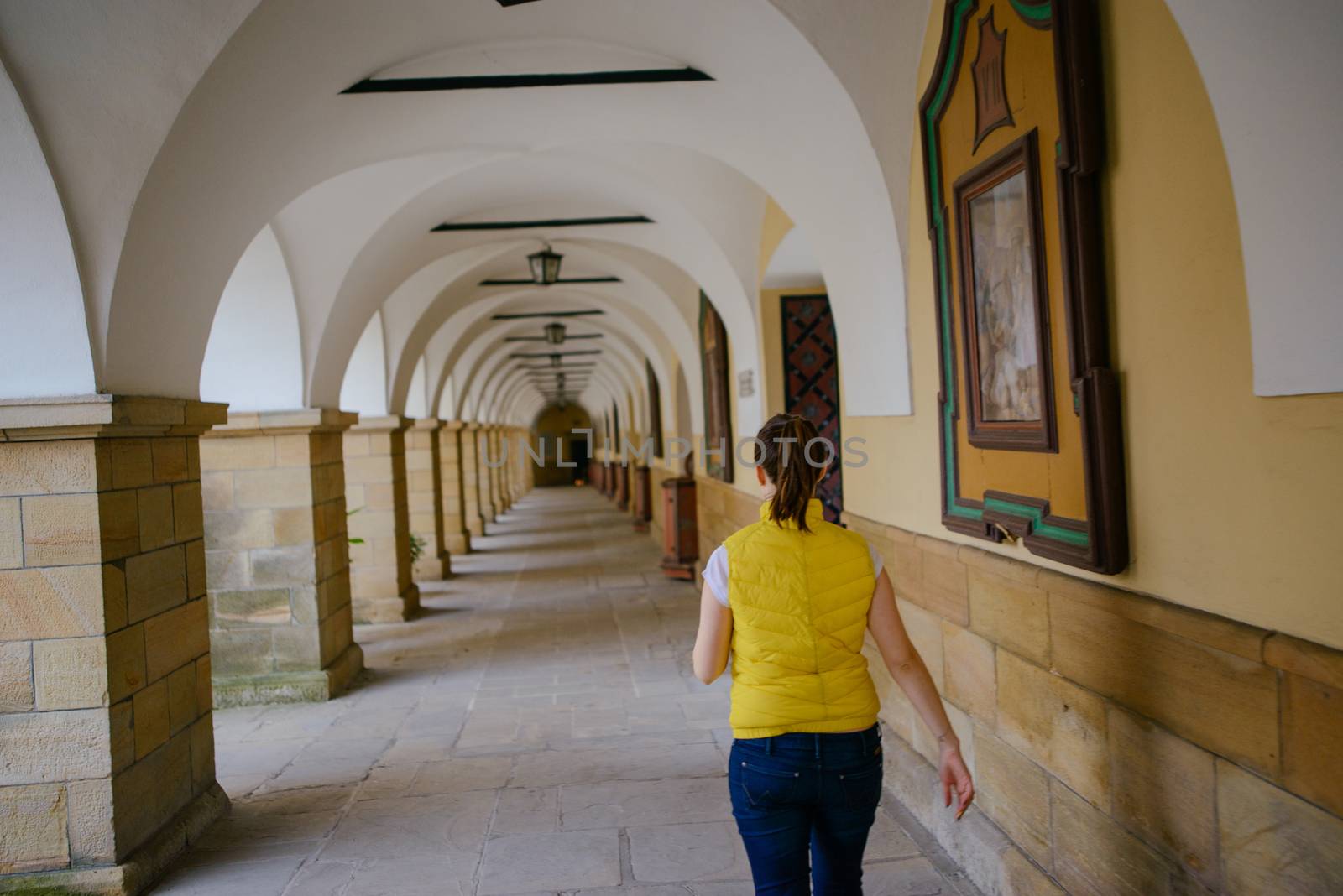 Beautiful girl during sightseeing old castle in Cracow, Wawel. Summer time