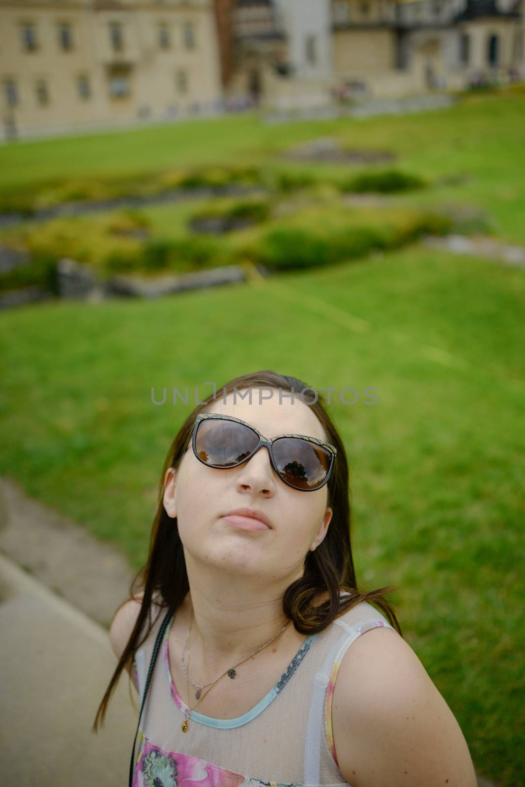 Beautiful girl during sightseeing old castle in Cracow, Wawel. Summer time