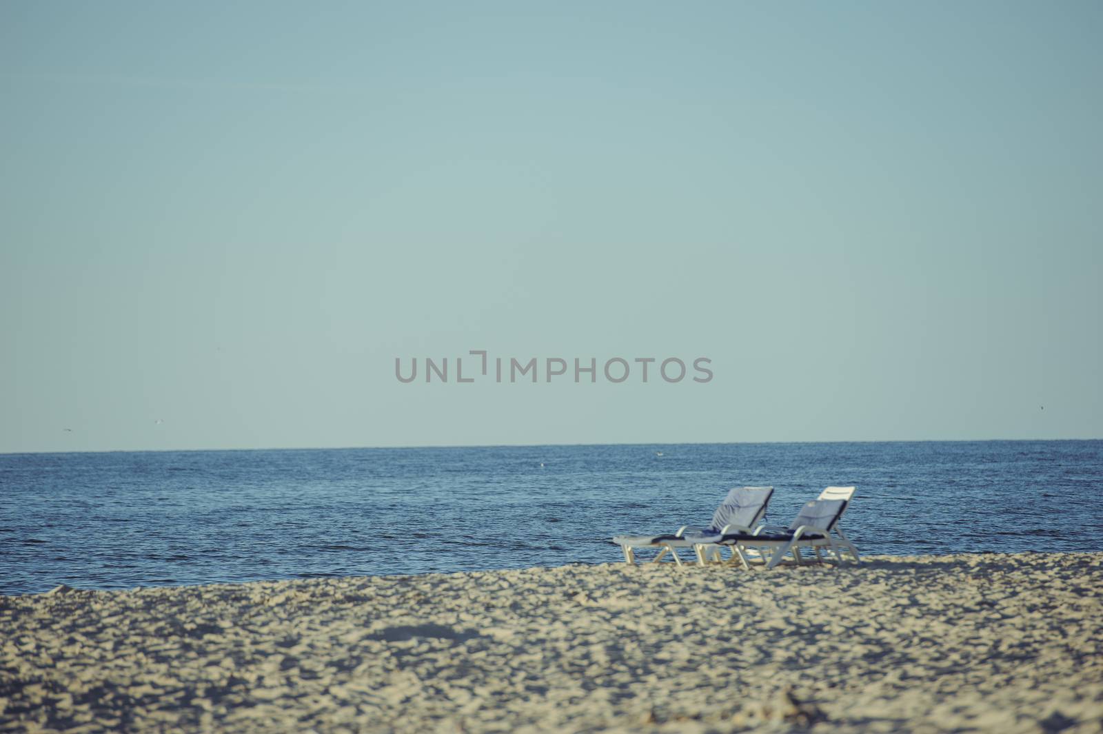 Beach lounger on the beach. Summer time