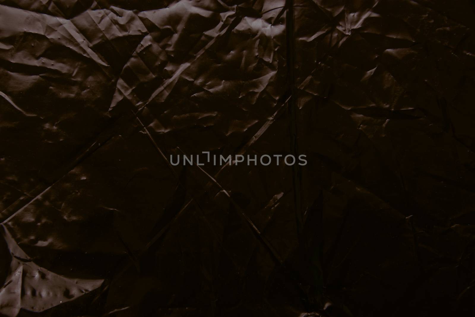 Crumpled plastic film texture . High resolution