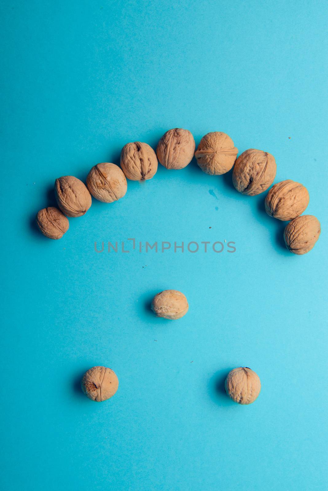 Walnuts, walnuts close-up, walnuts on a blue background