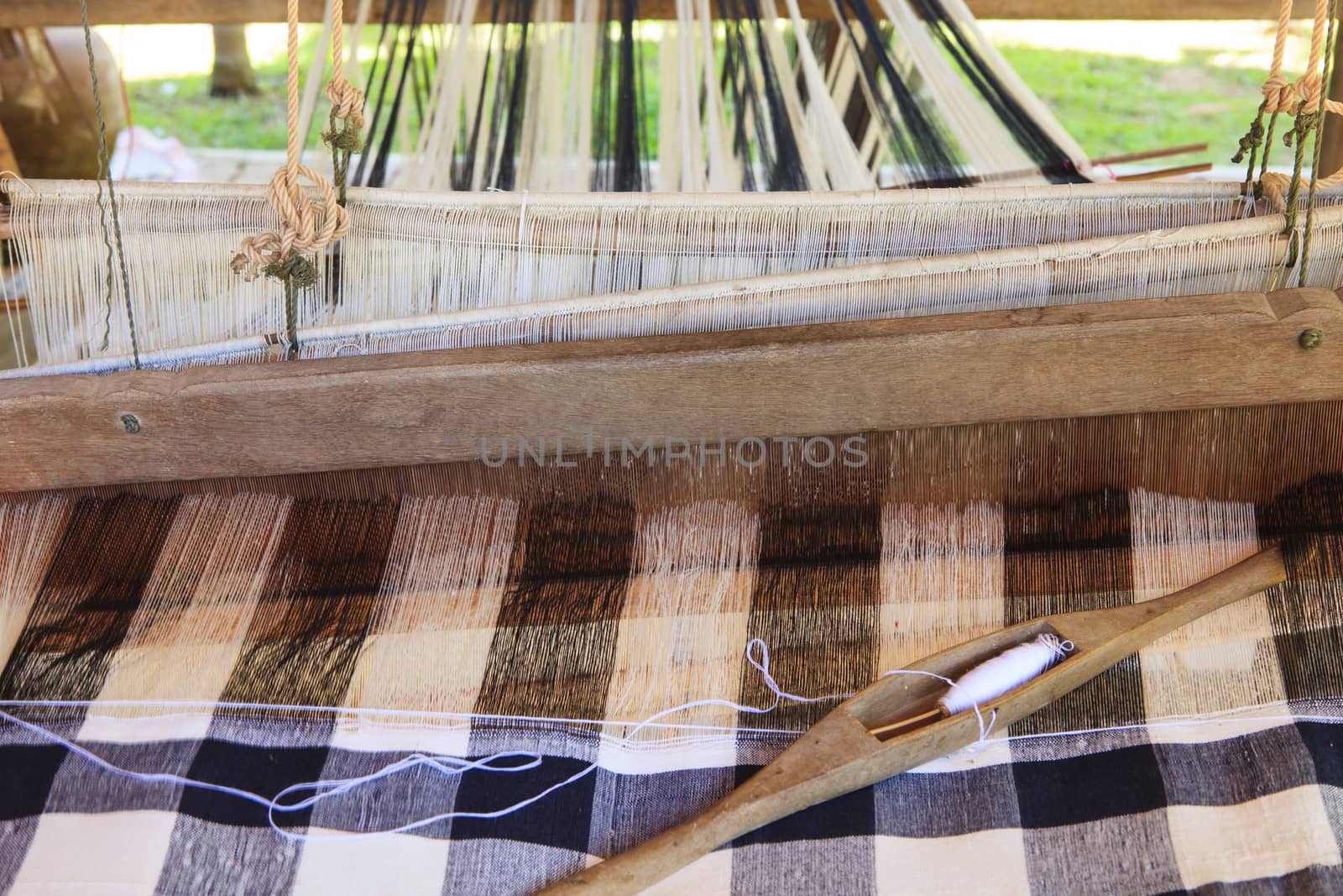 weaving shuttle on thai tradition clothes weaving  by khunaspix