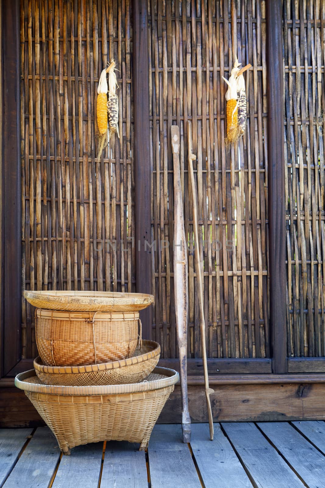 thai bamboo basket hand craft with wood wall  rural home scene in thailand