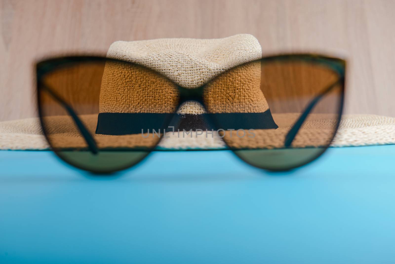 Straw hat and sunglasses by Brejeq