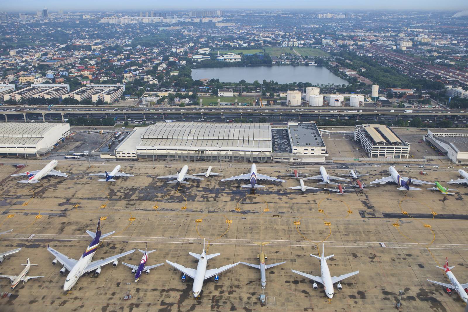 BANGKOK THAILAND AUGUST 20 : passenger and comercial plane parking on Donmuang Airport runways on august 20,2014  Bangkok Thailand 