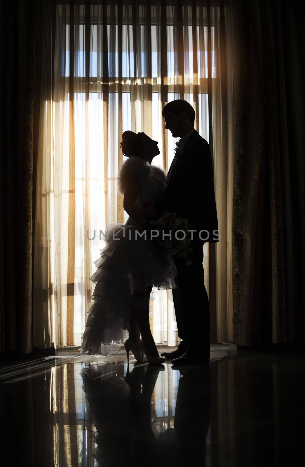 Silhouette of bride and groom in wedding day