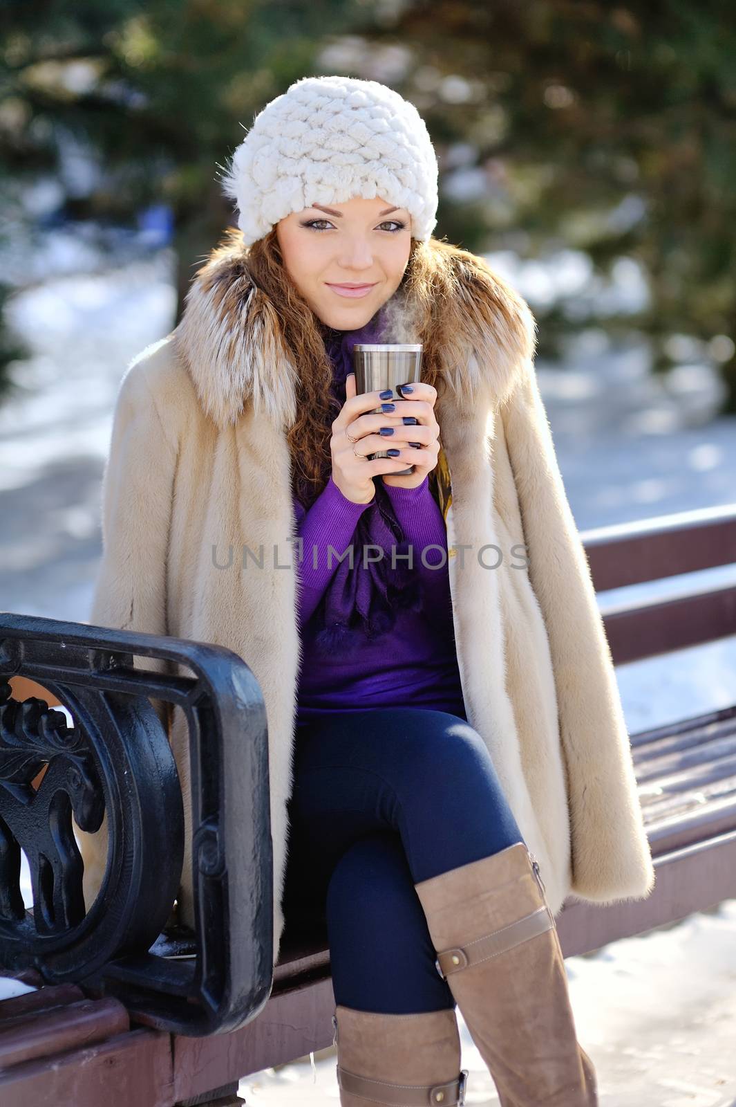 Beautiful Happy Smiling Winter Woman with Mug Outdoor. Laughing Girl Outdoors with Hot Drink 