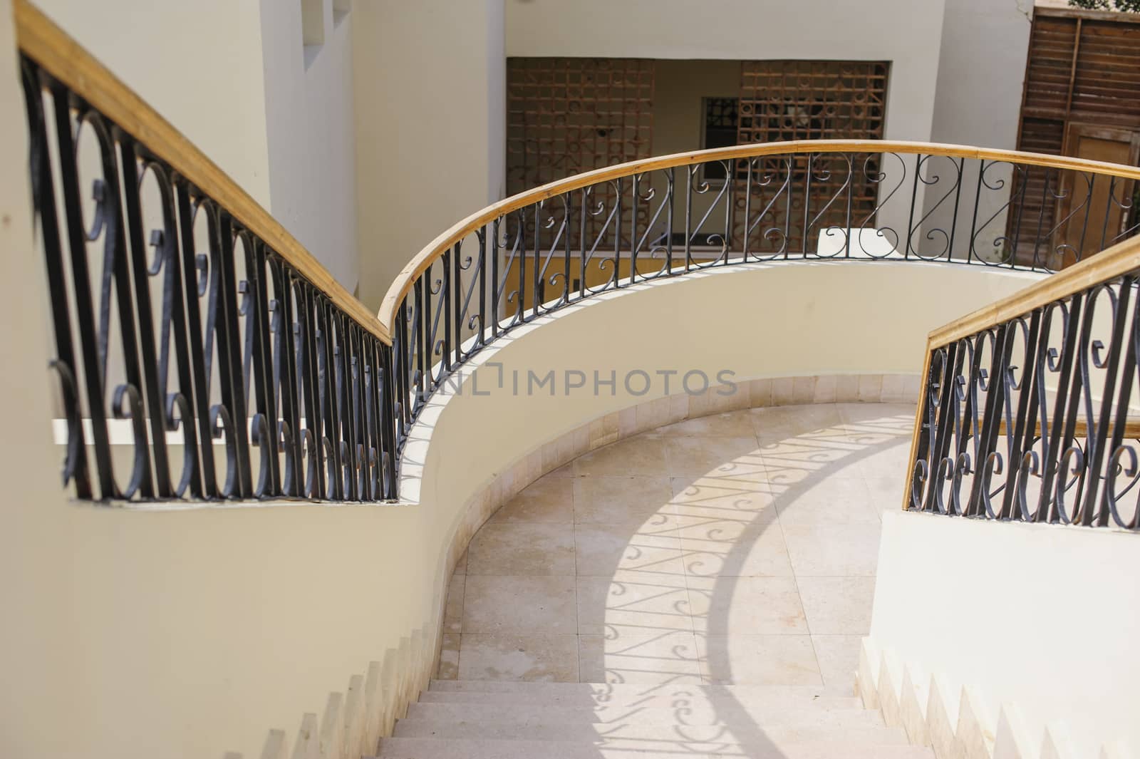 curved stairway in luxury shopping mall 