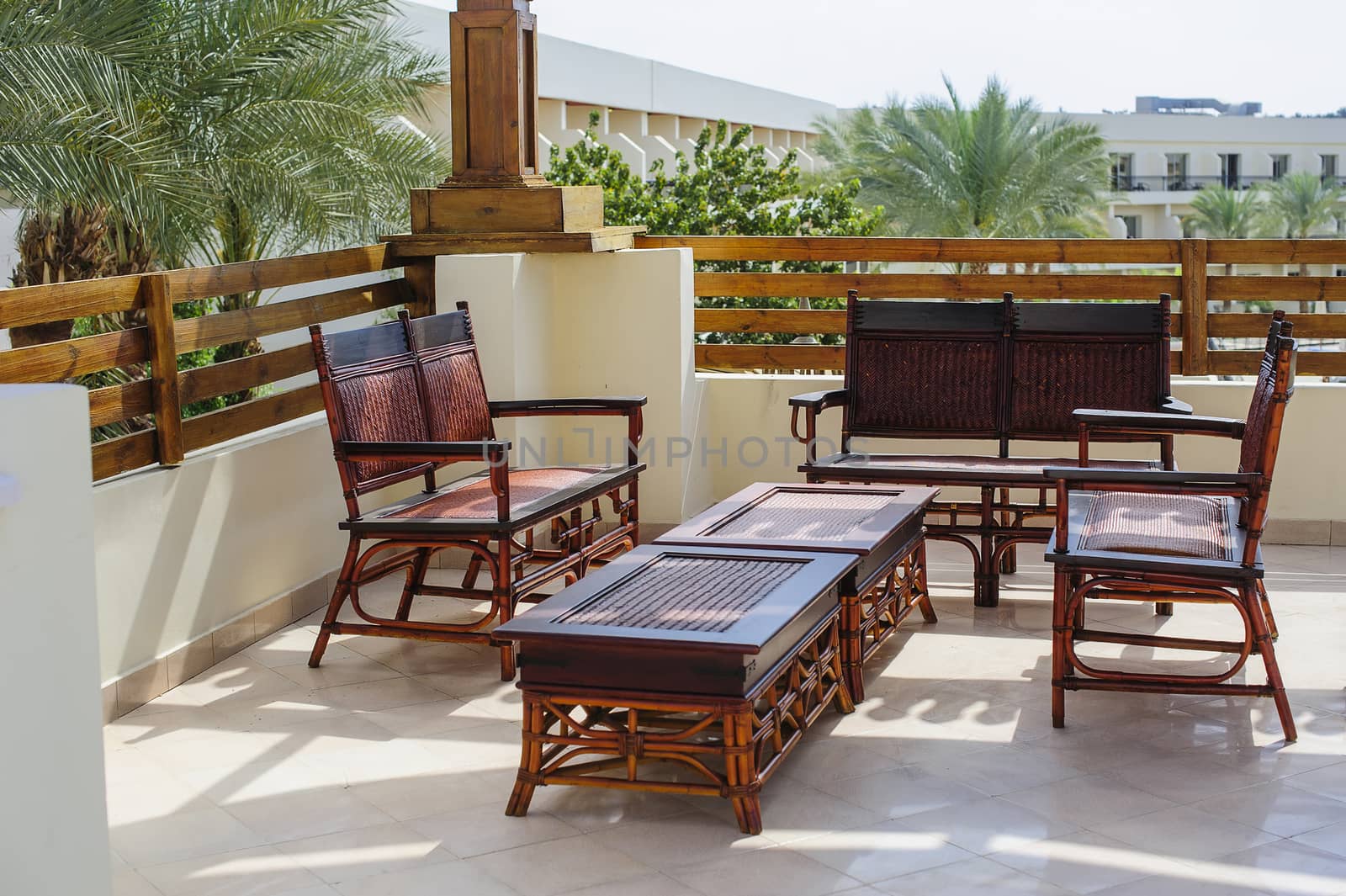 outdoor furniture rattan armchairs and table on terrace 