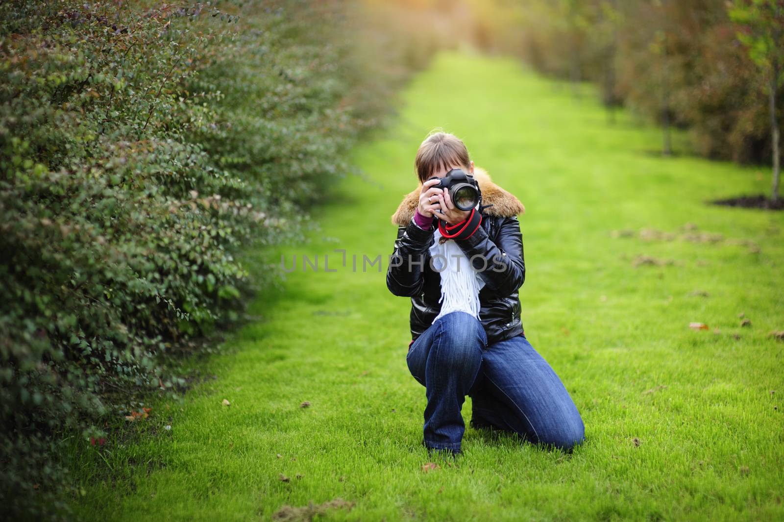 Photographer taking pictures outdoors