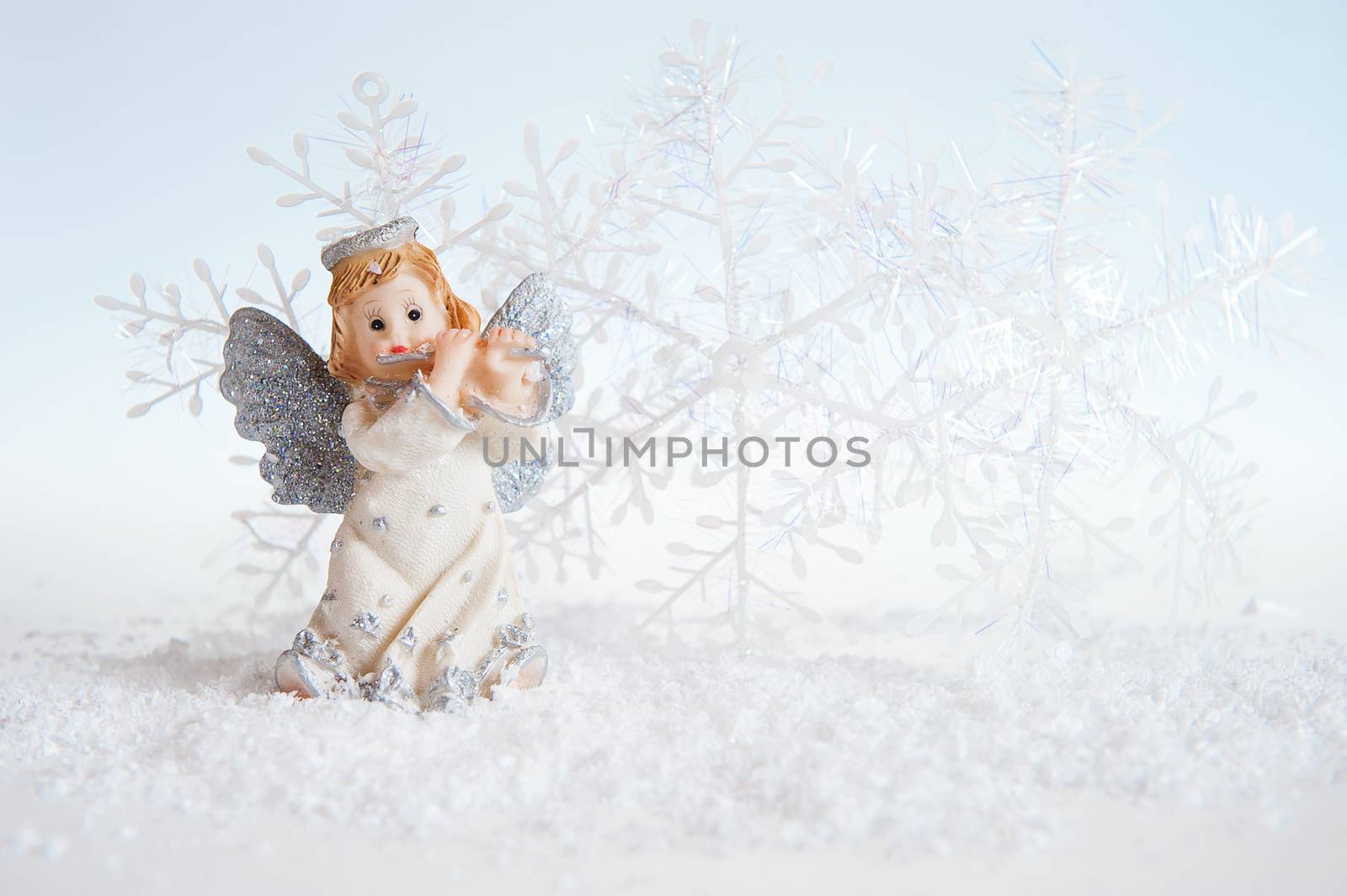 Christmas angel on silver background 