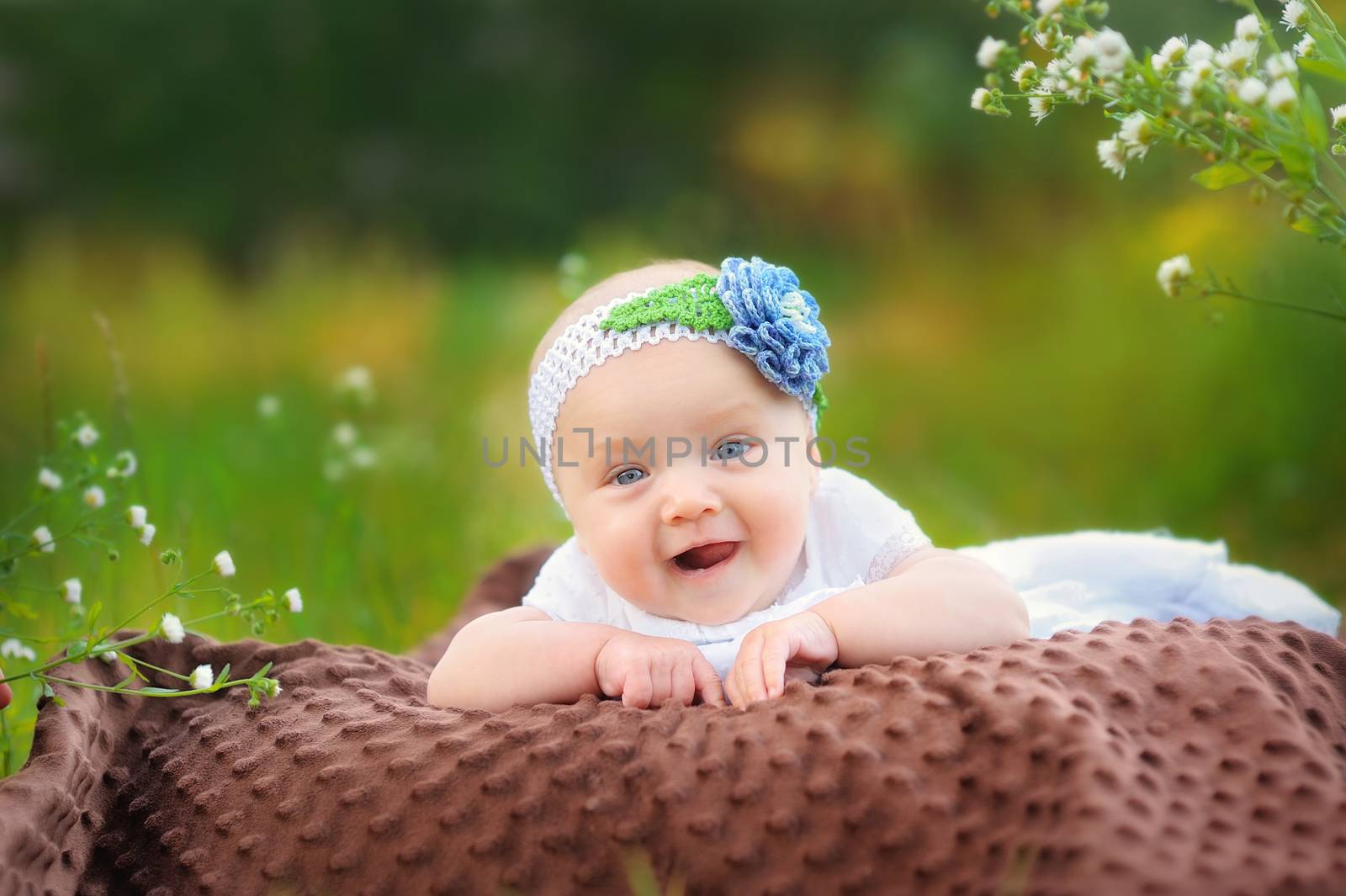 Baby on the grass in the park